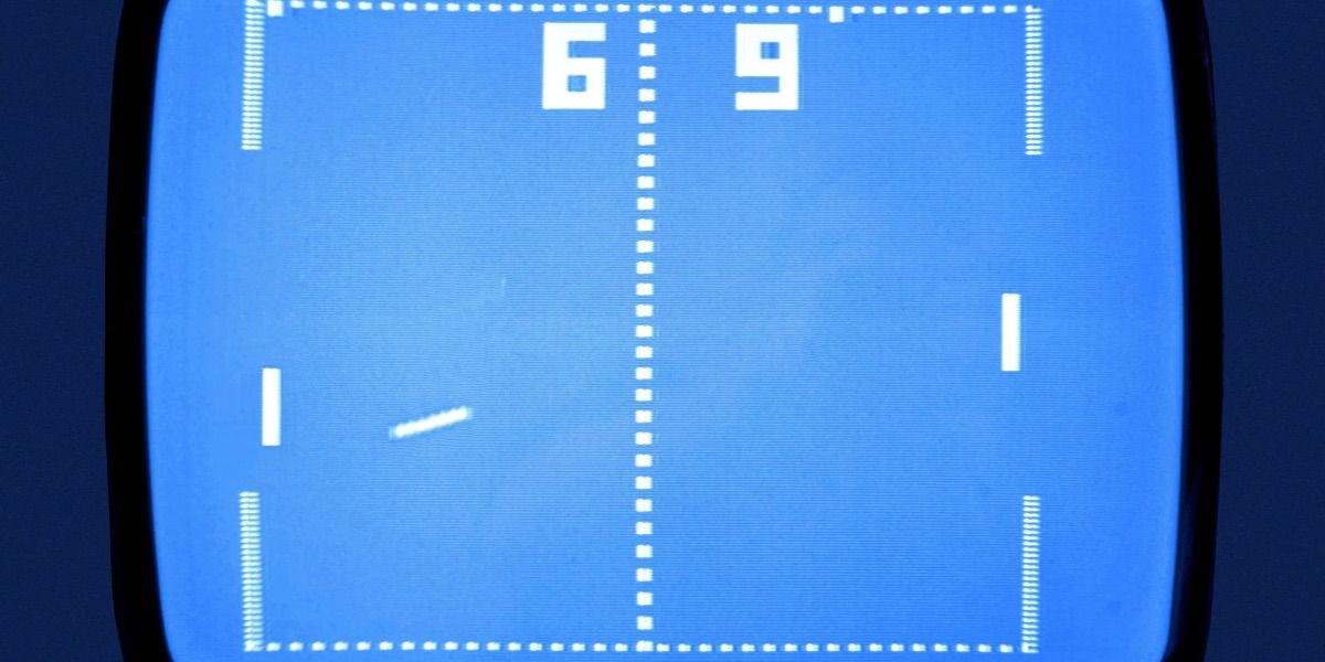 A ball flies across a blue screen in the Atari Pong game