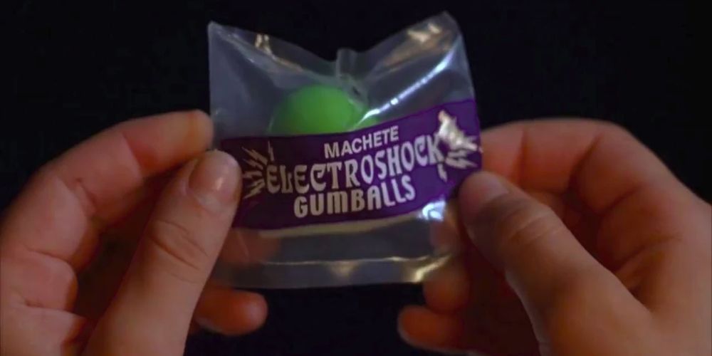 Hands holding a bag of Electroshcok Gumballs at Spy Kids